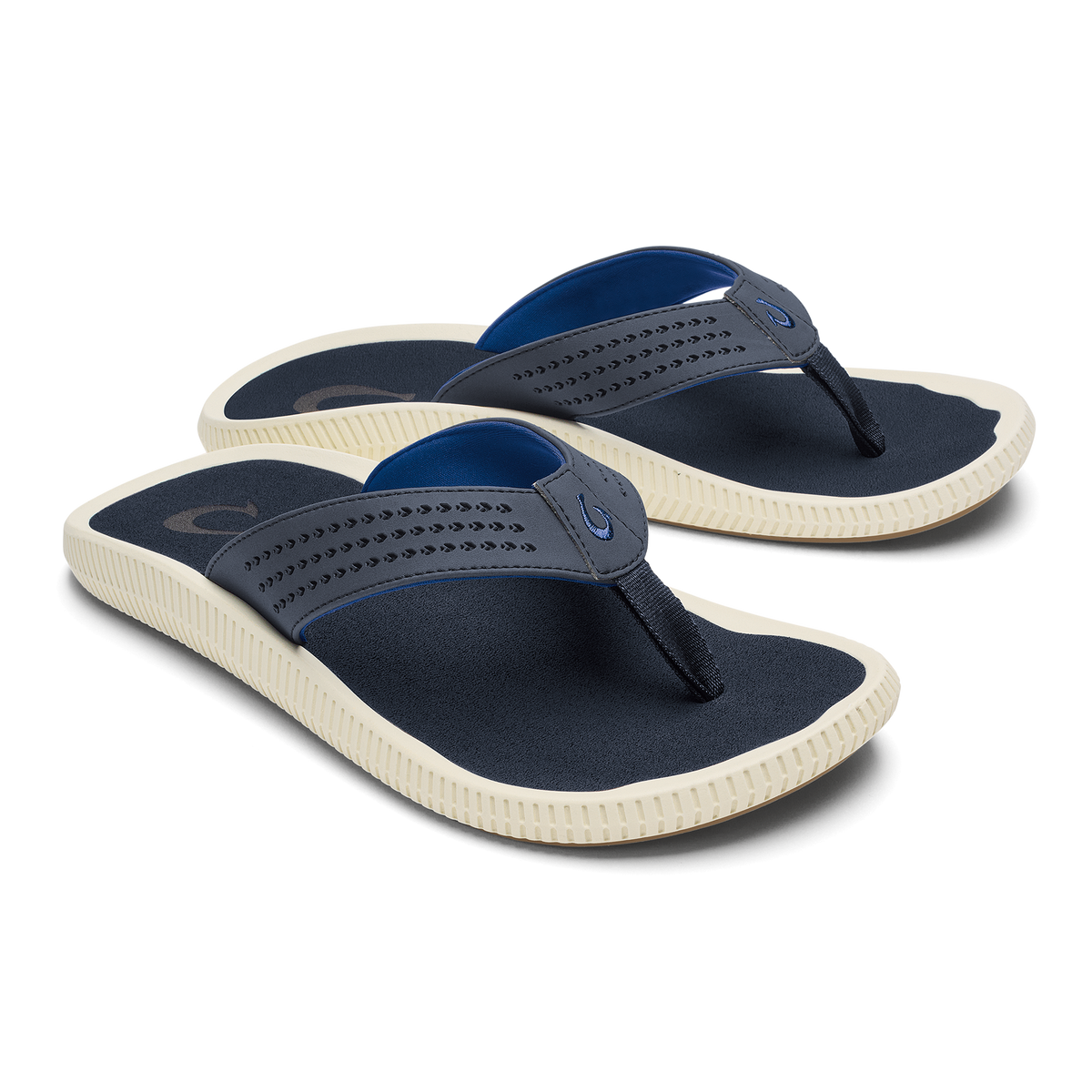 Pair of navy and blue thong sandals with cream-colored ribbed soles and perforated straps.