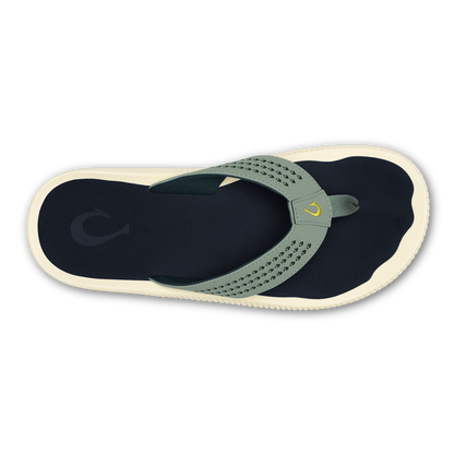 Seagreen and navy thong sandal with perforated strap and cream sole, viewed from above.