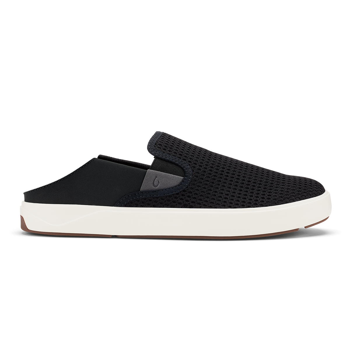 Black knit slip-on mule with white rubber sole and brown heel accent.