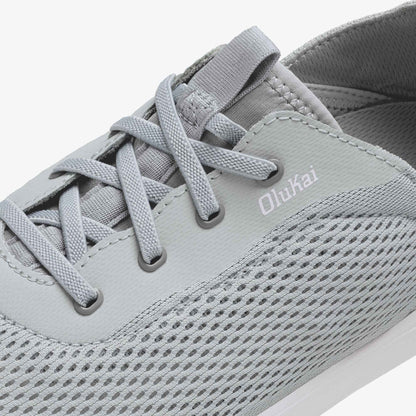 Grey lace-up athletic shoe with mesh and synthetic upper, showing Olukai branding on the side.