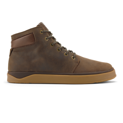 Dark brown leather high-top boot with toffee-colored sole and brass eyelets, shown from the side.