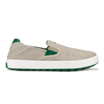 Beige canvas slip-on sneaker with white midsole and green heel counter and outsole.