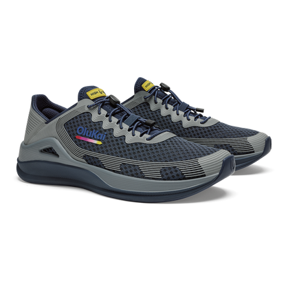 Navy and gray mesh running shoe with wavy stripe detailing, yellow tongue tab, and dark sole.
