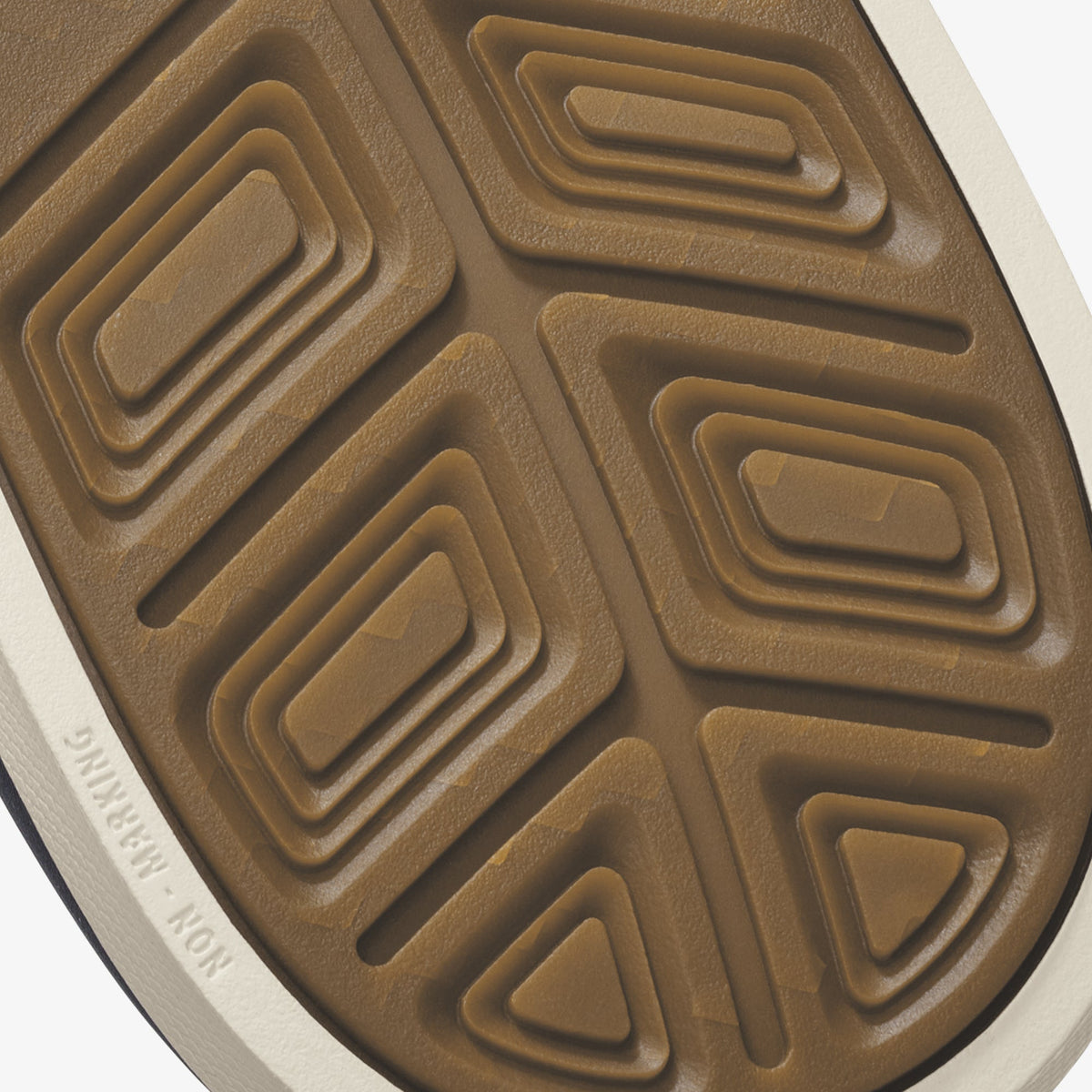 Tan and cream sole with concentric rectangular tread pattern and embossed branding.