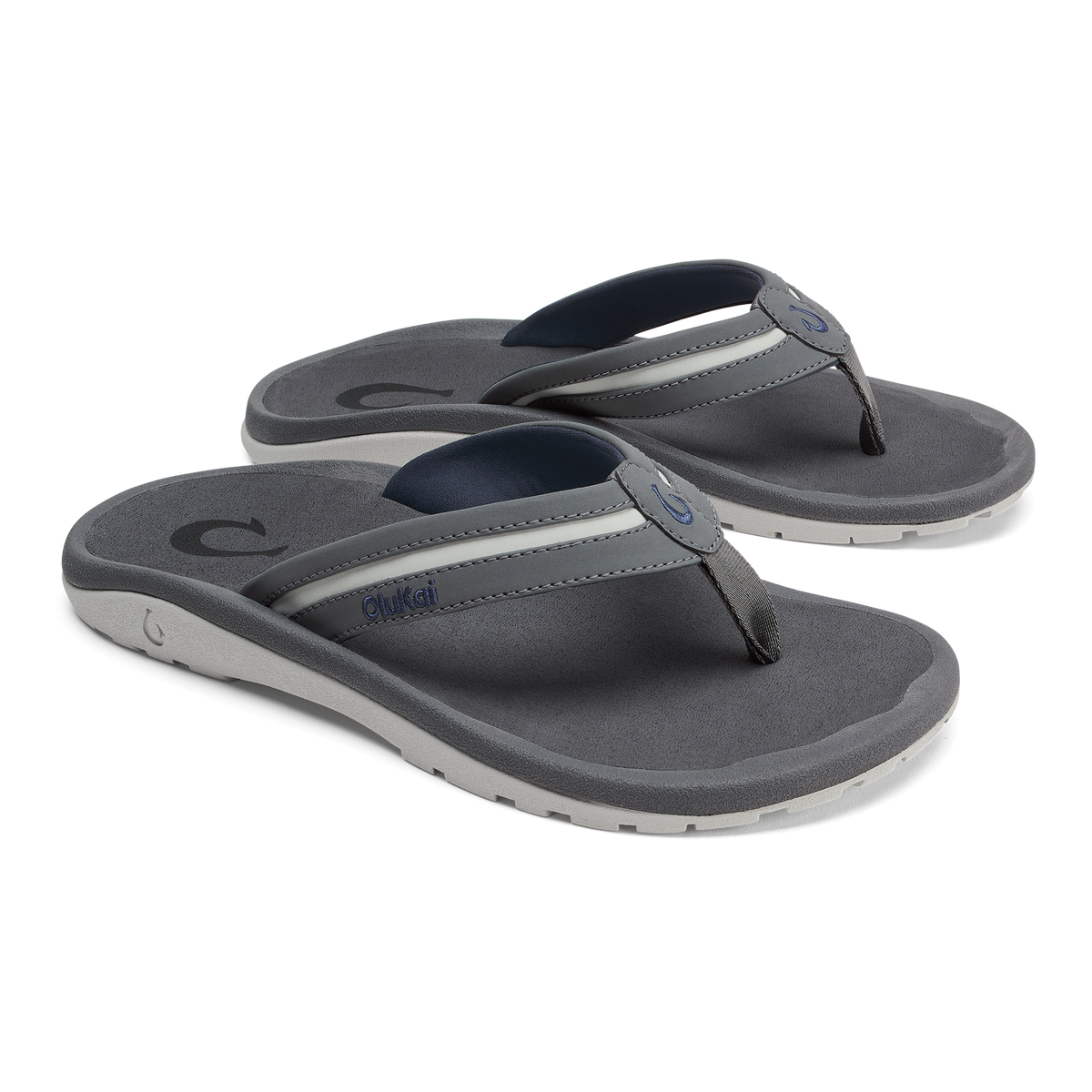 Pair of grey and navy thong sandals with cushioned footbeds and white midsoles.