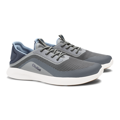 Charcoal and gray mesh athletic shoe with white sole and dark laces.