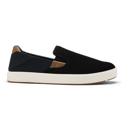 Black slip-on sneaker with tan heel panel and cream rubber sole.