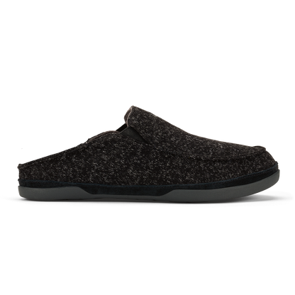 Black knit slip-on clog slipper with gray sole against white background.