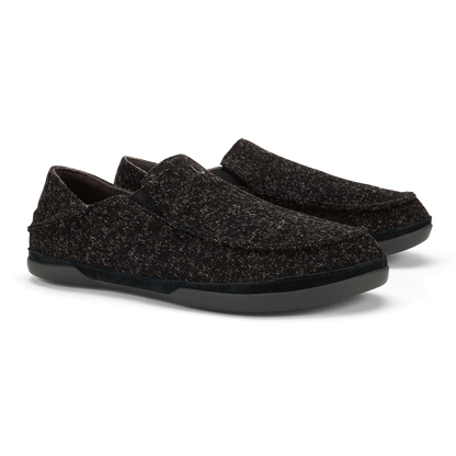 Black textured slip-on loafers with thick rubber soles, shown from the side.