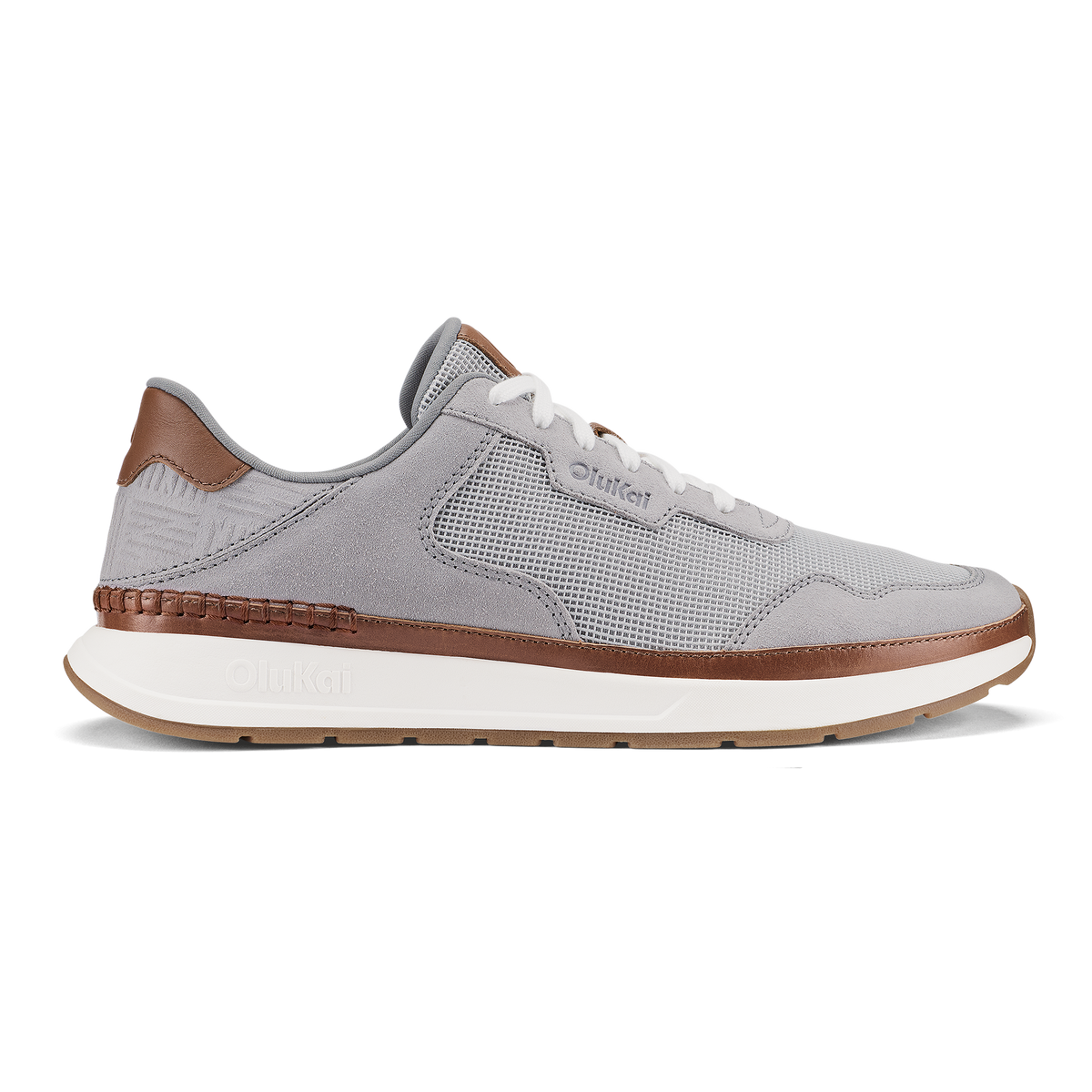 Light grey and brown sneaker with mesh upper, white laces, and cream-colored sole.