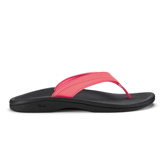 Hot pink and black thong sandal with curved black sole and padded pink strap.
