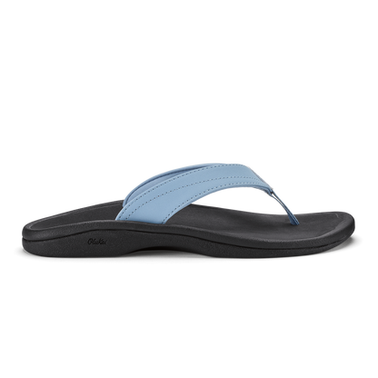 Light blue thong sandal with black sole and strap, featuring stitched detailing.
