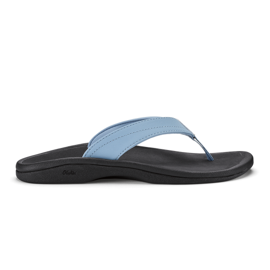 Light blue thong sandal with black sole and strap, featuring stitched detailing.