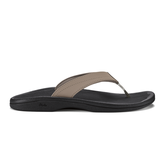 Warm taupe and black thong sandal with curved black sole and stitched toe strap.