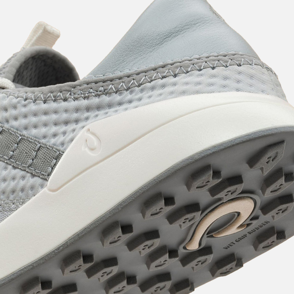 Cloud grey slip-on shoe with mesh upper, white midsole, and textured grey outsole detail.