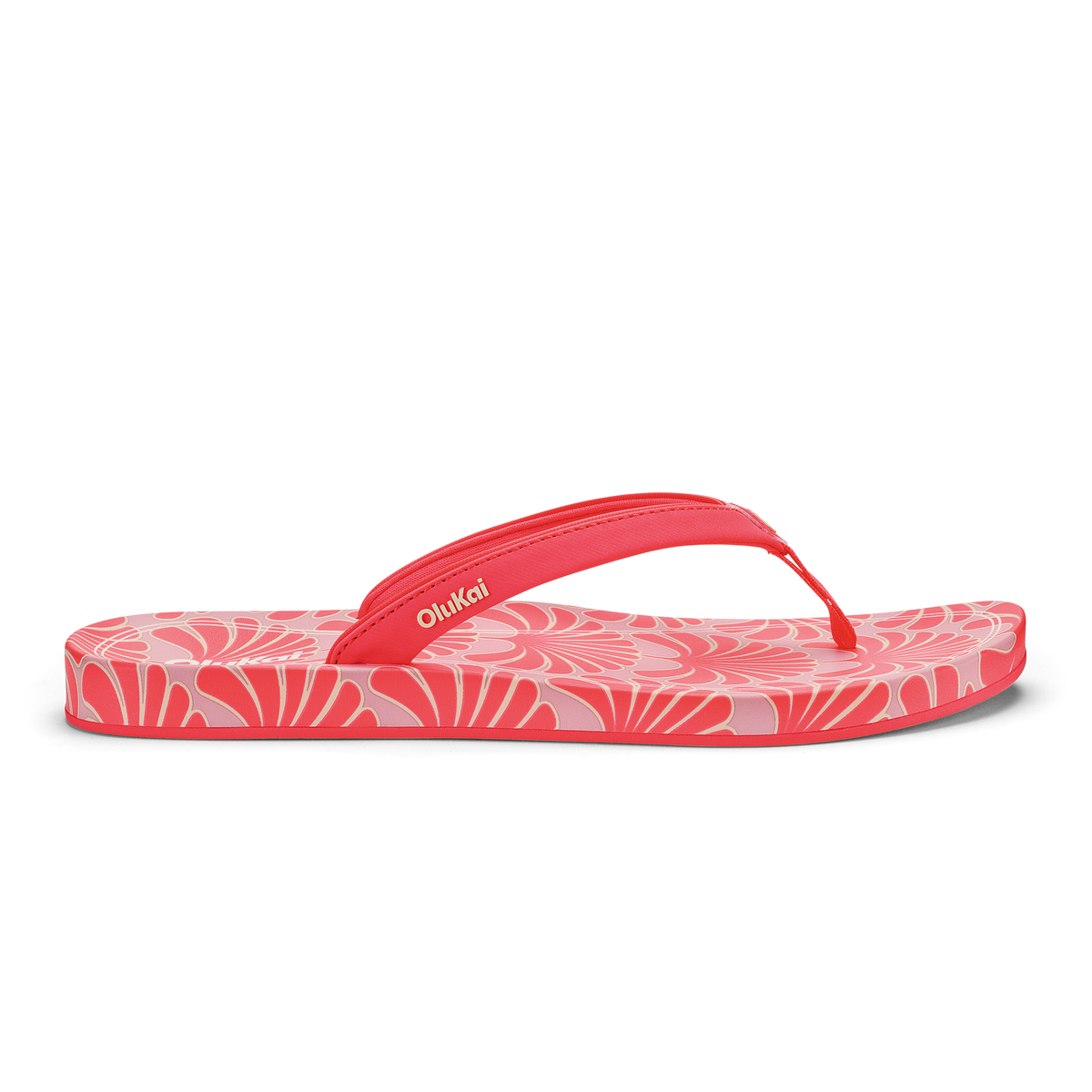 Hot pink flip-flop with shell pattern design and red toe strap.