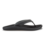 Black thong sandal with ribbed sole and studded upper strap.