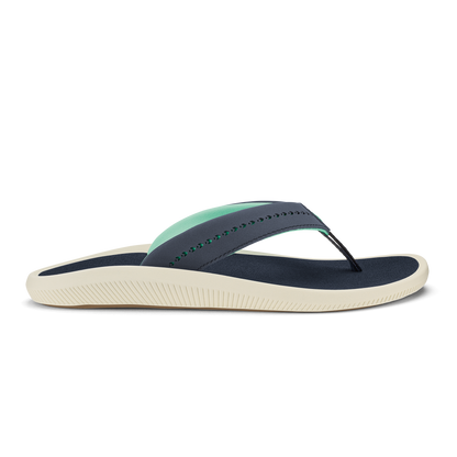 Trench blue thong sandal with mint green strap detail and cream-colored textured sole.