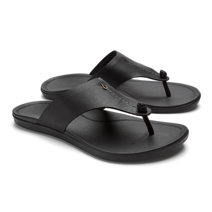 Black thong sandals with cushioned footbeds and decorative knot details on the straps.