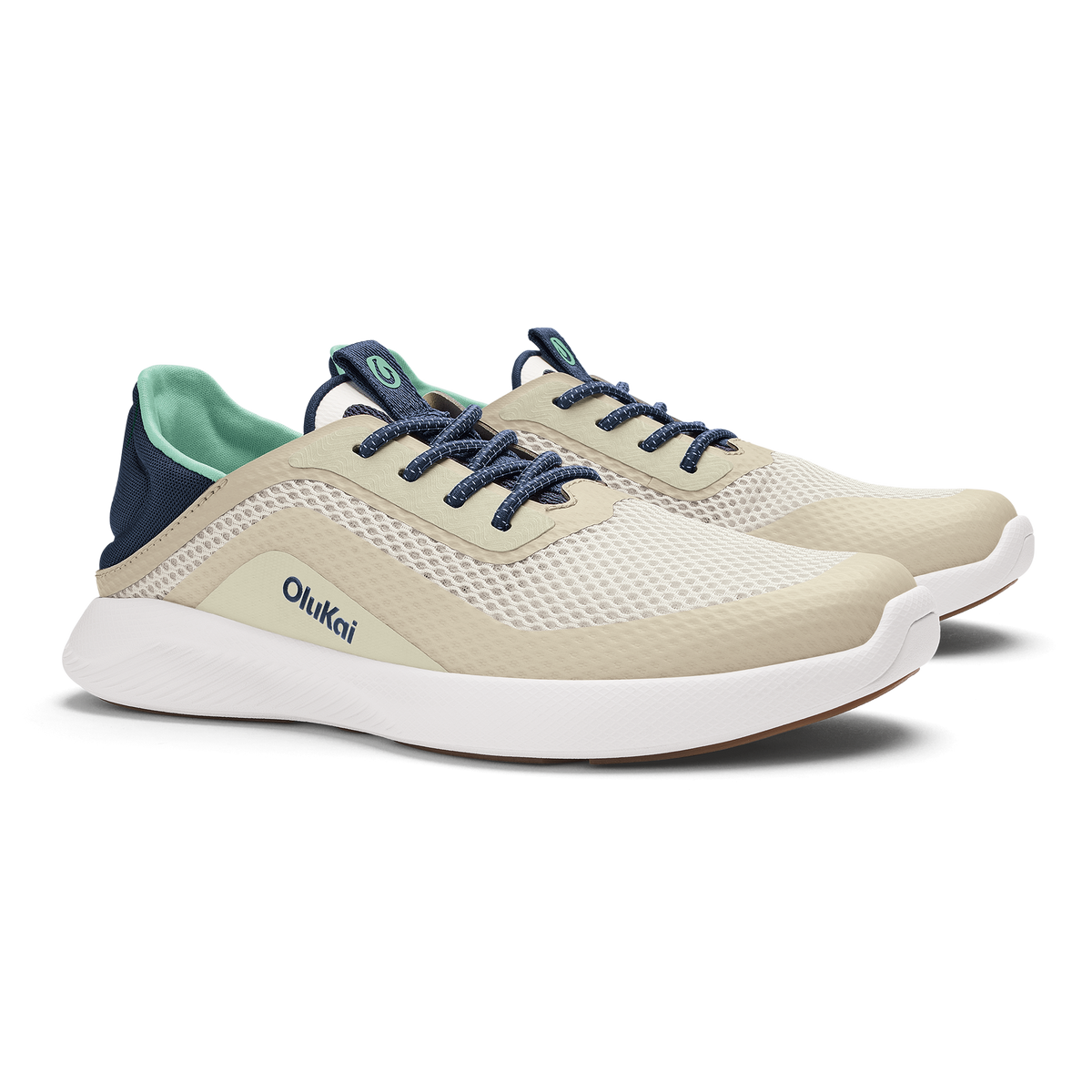 Cream and white mesh running shoe with navy laces, navy heel counter, and mint green interior lining.