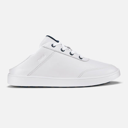 White leather sneaker mule with dark blue heel collar and laces, white sole, shown from the side.