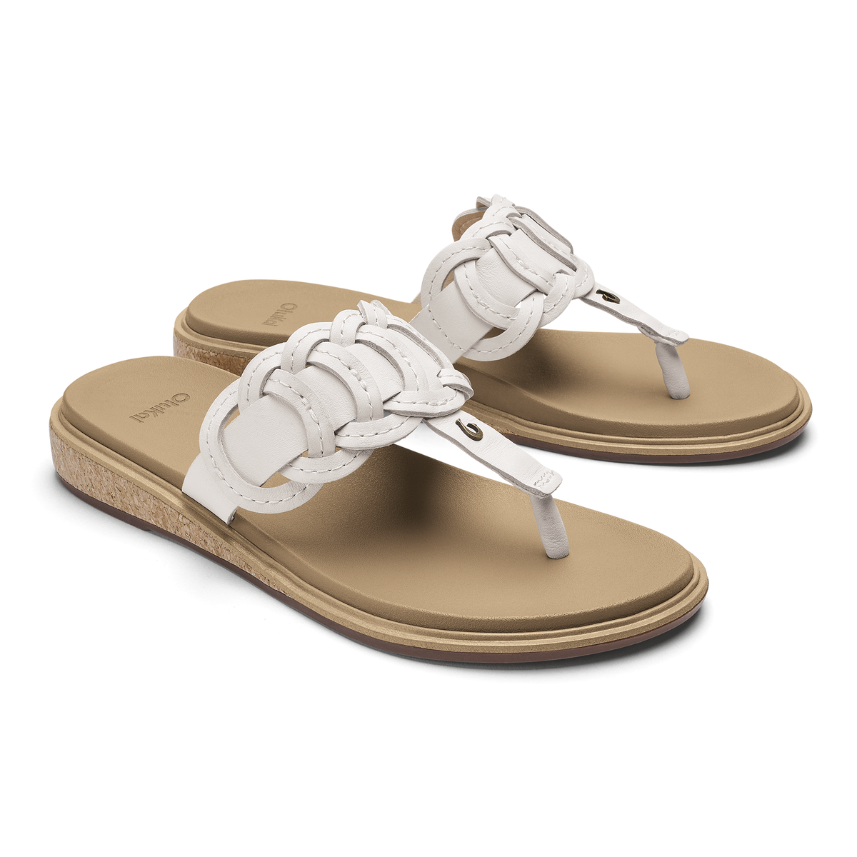 Pair of white and tan thong sandals with braided leather straps and cork wedge soles.
