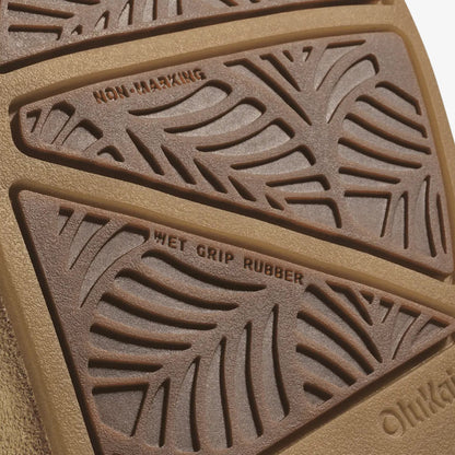 Tan rubber sole showing non-marking tread on top section and wet grip rubber pattern on bottom section.
